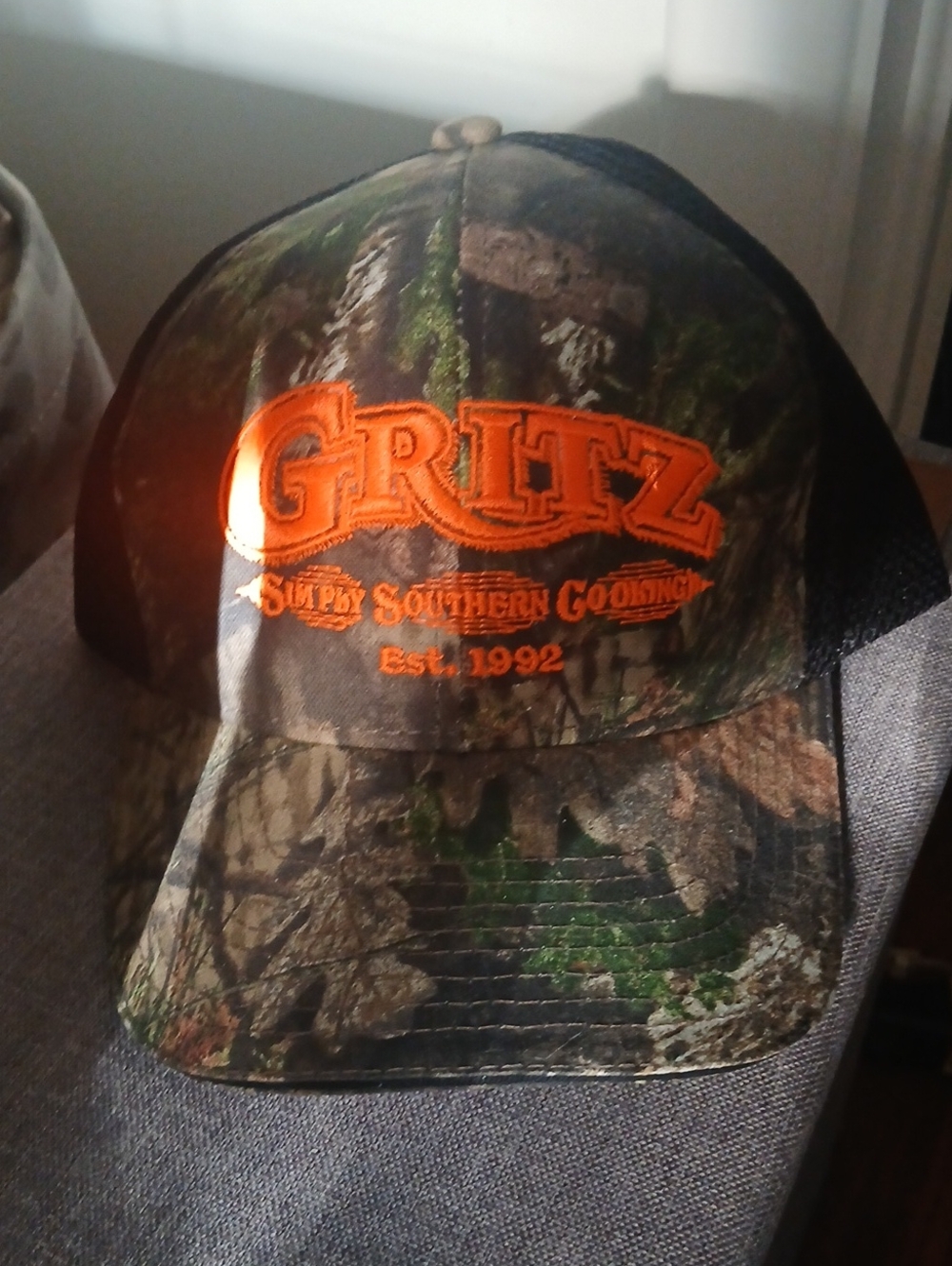 Unisex Camo Trucker Cap in Orange and Green